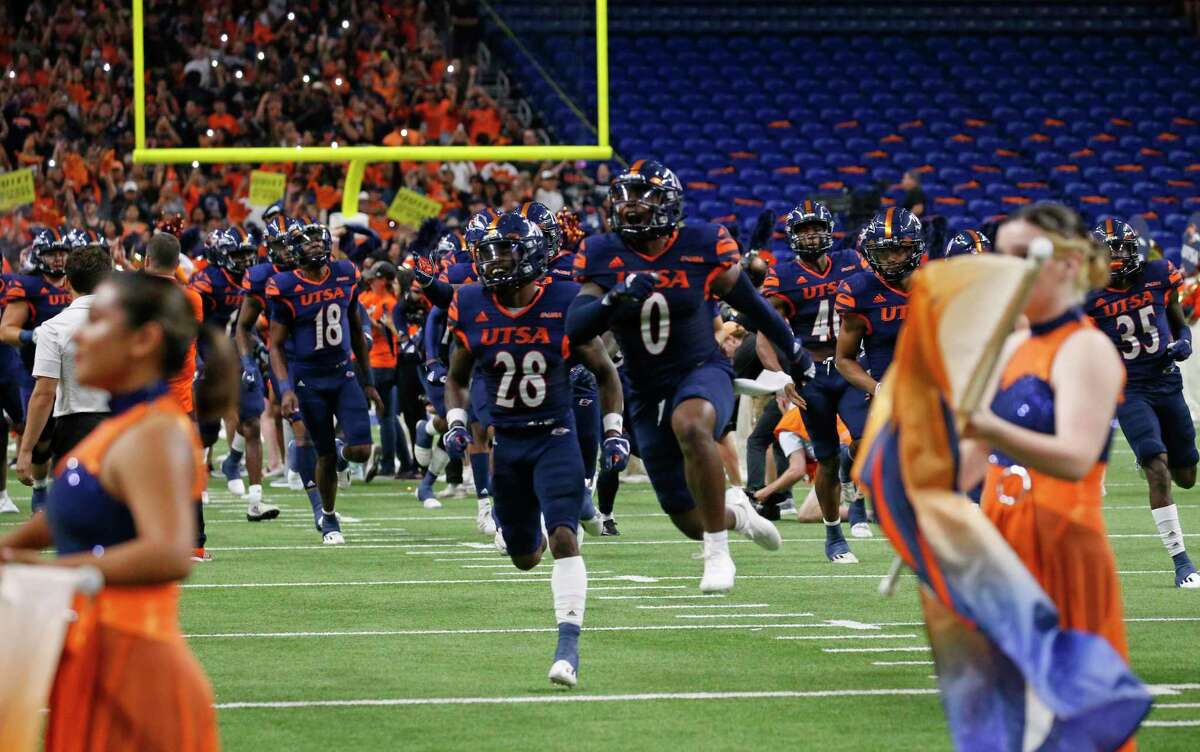 UTSA football team runs no to the field before the start of their game against Houston on Saturday, Sept. 3, 2022 at the Alamodome.
