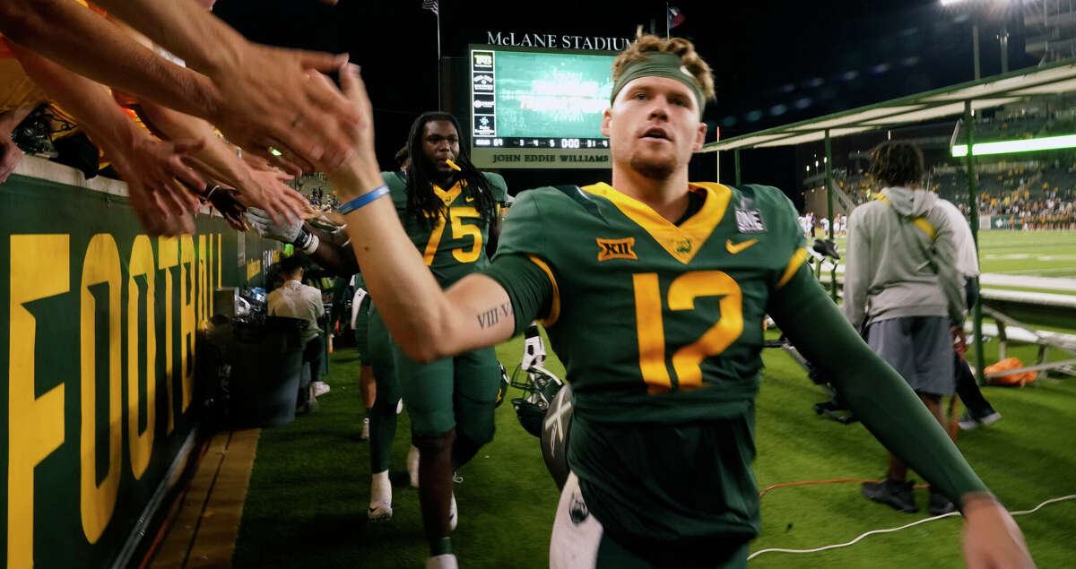 Baylor quarterback Blake Shapen (12) is congratulated by fans in the stands after a win over Albany in an NCAA college football game in Waco, Texas, Saturday, Sept. 3, 2022. (AP Photo/LM Otero)
