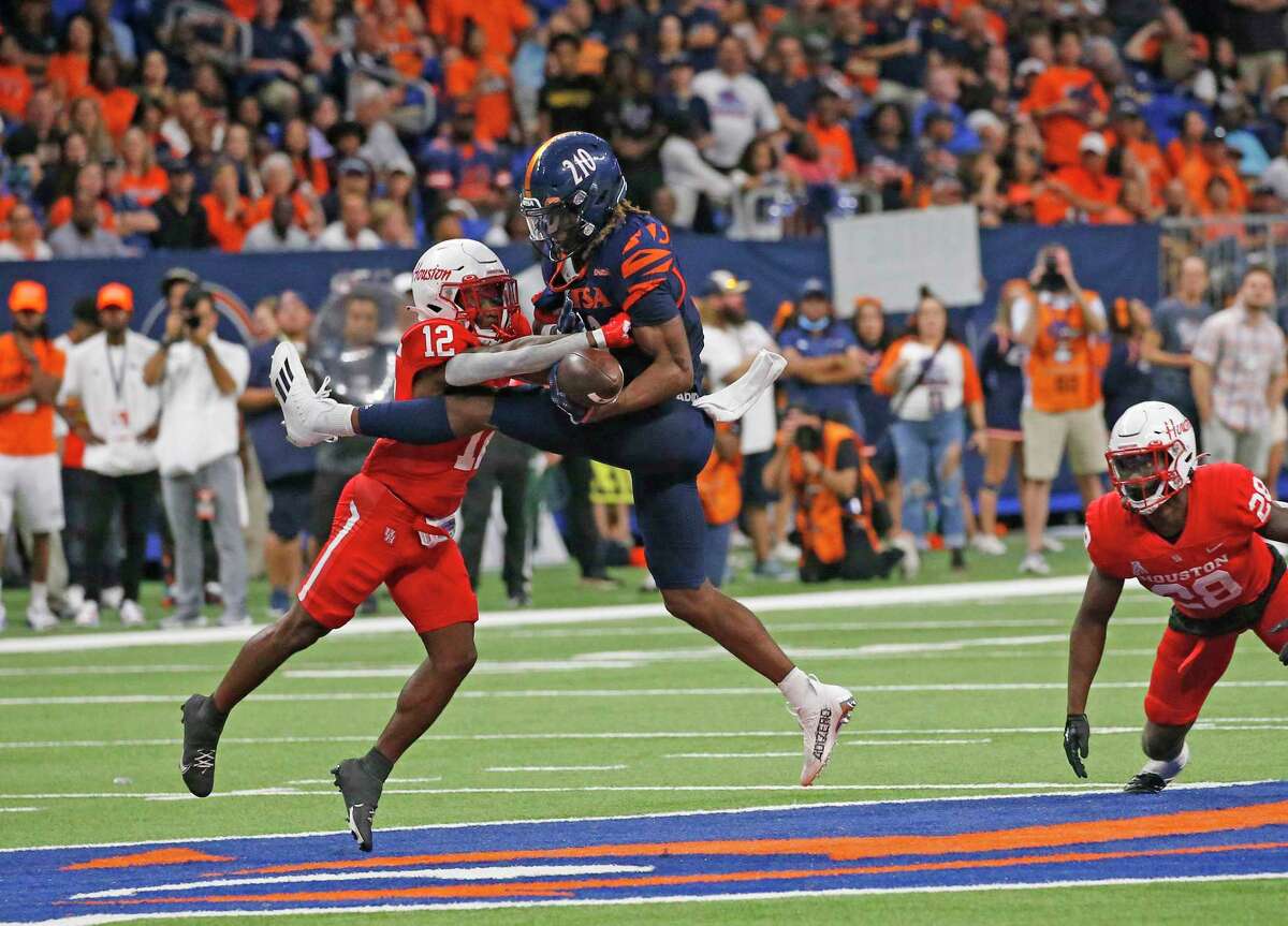 UTSA Roadrunners wide receiver Joshua Cephus (2) reception help his team to move close enough for a field goal to tie the score at regulation as he is tackled by Houston DeMarcus Griffin-Taylor (12) on Saturday, Sept. 3, 2022 at the Alamodome.