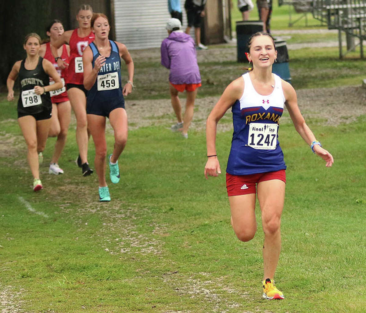 Roxana's Gabrielle Woodruff (right) runs the final 200 meters in her medal-winning race in the Granite City Robinson/Lang Invitational on Saturday at Wilson Park.