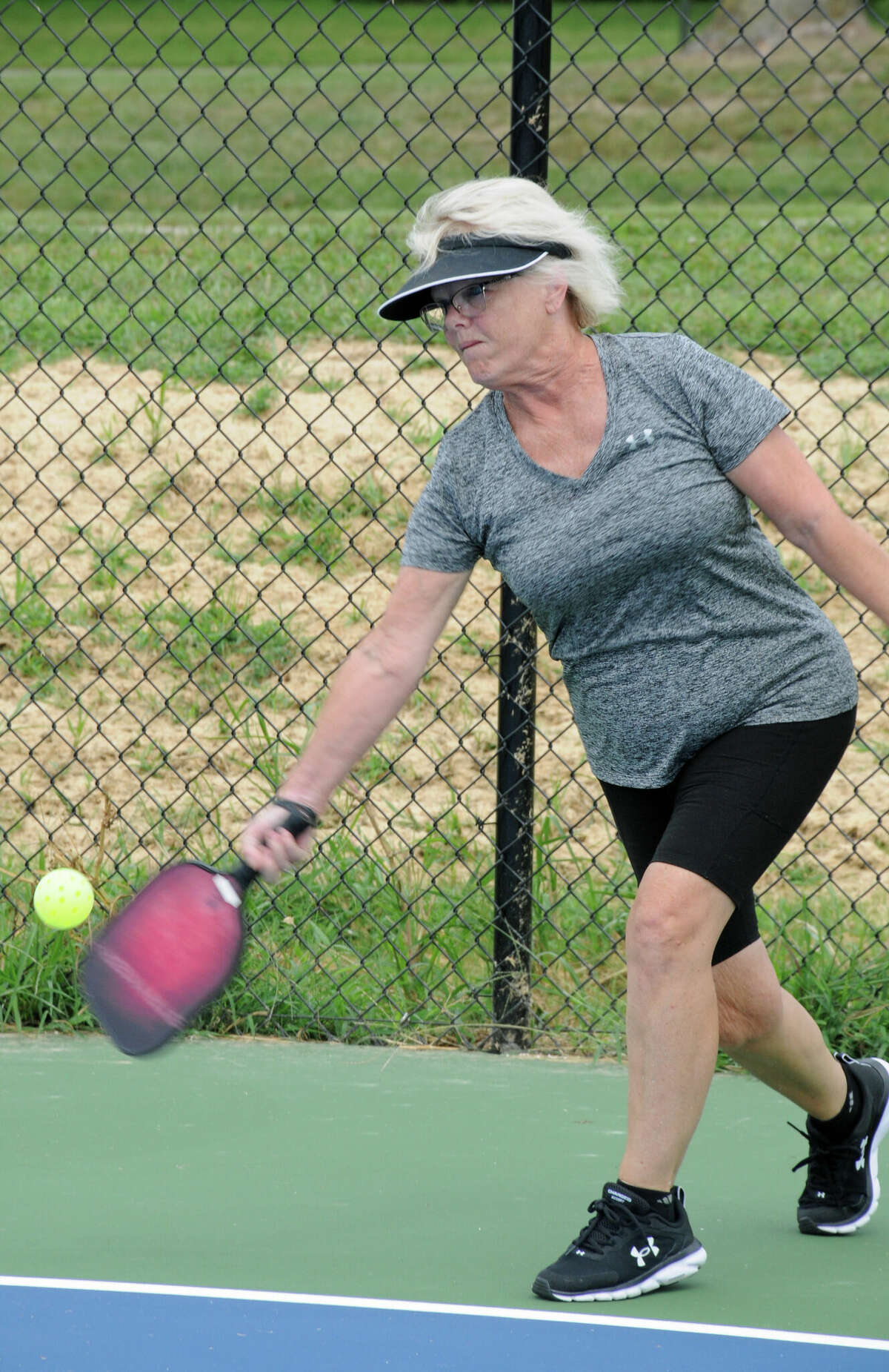 Jane Short returns a serve at the new pickleball courts in Glazebrook Park on Saturday.