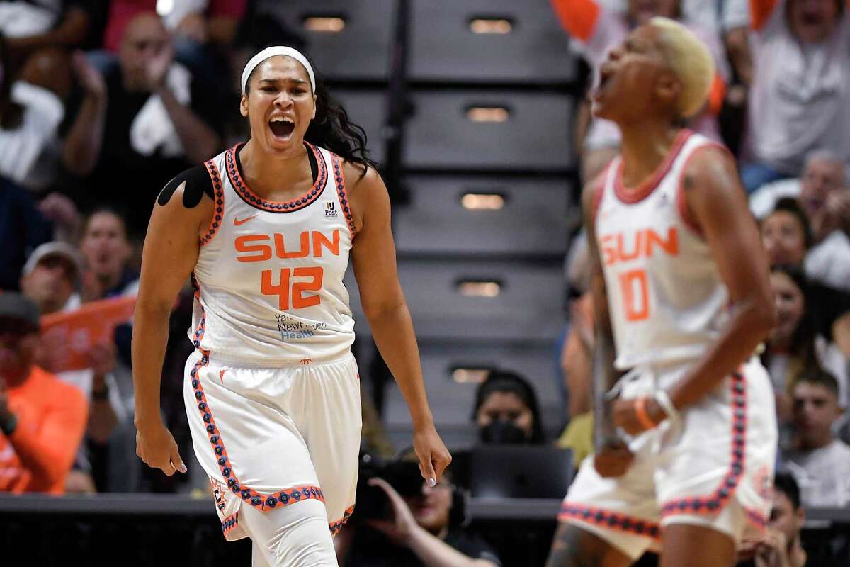 Connecticut Sun center Brionna Jones, left, reacts toward teammate Courtney Williams during Game 3 of a WNBA basketball semifinal playoff series, Sunday, Sept. 4, 2022, in Uncasville, Conn.