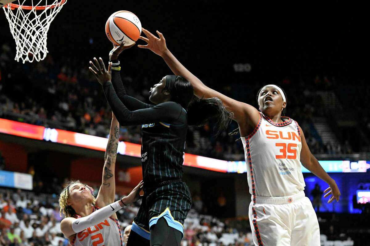 Connecticut Sun forward Jonquel Jones, right, knocks away a shot attempt by Chicago Sky guard Kahleah Copper during Game 3 of their WNBA semifinal playoff series Sunday in Uncasville.