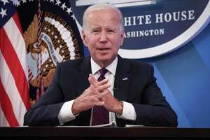 Biden urges drivers to buy EVs after IRS eases rebate rules