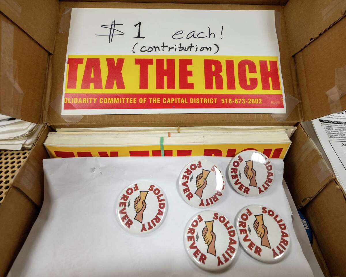 Tax The Rich bumper stickers on sale at the annual Labor Day Picnic held by the Solidarity Committee of the Capital District at Cook Park in Colonie, NY, on Monday, Sept. 5, 2022 (Jim Franco/Special to the Times Union)