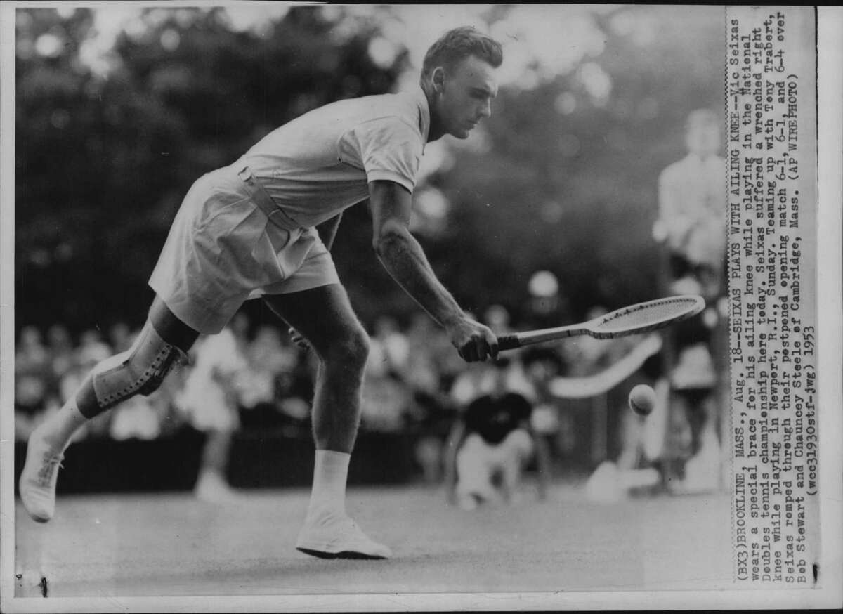 Brookline, Massachusetts - Vic Seixas wears a special brace for his ailing knee while playing in the National Doubles tennis championship here today. Seixas suffered a wrenched right knee while playing in Newport, Rhode Island, Sunday. Teaming up with Tony Trabert, Seixas romped through their postponed evening matvh 6-1, 6-1, and 6-4 over Bob Steward and Chauncey Steele of Cambridge, Massachusetts. September 01, 1953 (Times Union Archive)