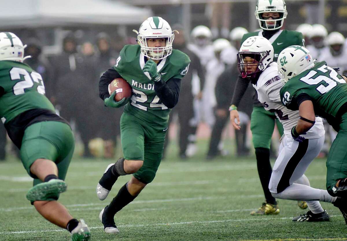 Maloney's Joshua Boganski (24) heads to the end zone for a touchdown during CIAC Class L state championship football action against Windsor at Veterans Stadium in New Britain, Conn., on Saturday December 11, 2021.