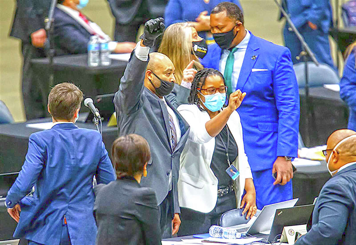 Rep. Justin Slaughter, D-Chicago, reacts in January 2021 amid the passage of the Safety, Accountability, Fairness and Equity-Today Act criminal justice reform.