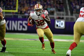 San Francisco 49ers tight end George Kittle jogs to the sideline during the  first half of an NFL preseason football game against the Los Angeles  Chargers, Friday, Aug. 25, 2023, in Santa