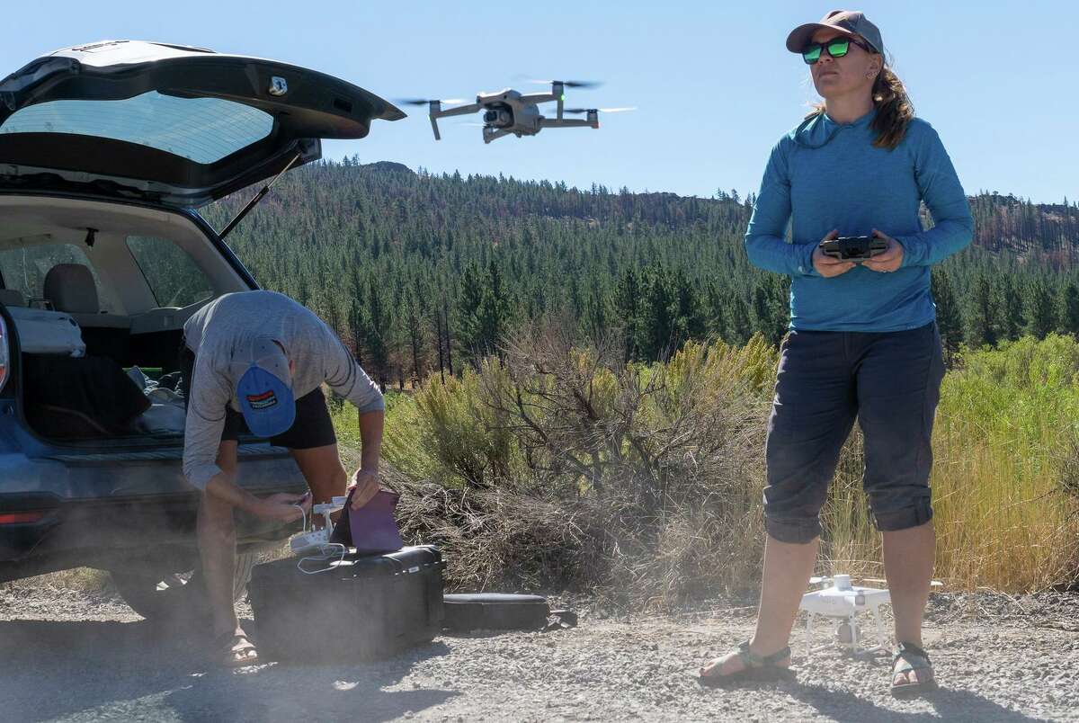 Environmental scientist Emily Fairfax and husband Andrew Peterson fly drones to explore beaver habitat at Frenchman Lake near Chilcoot (Plumas County).