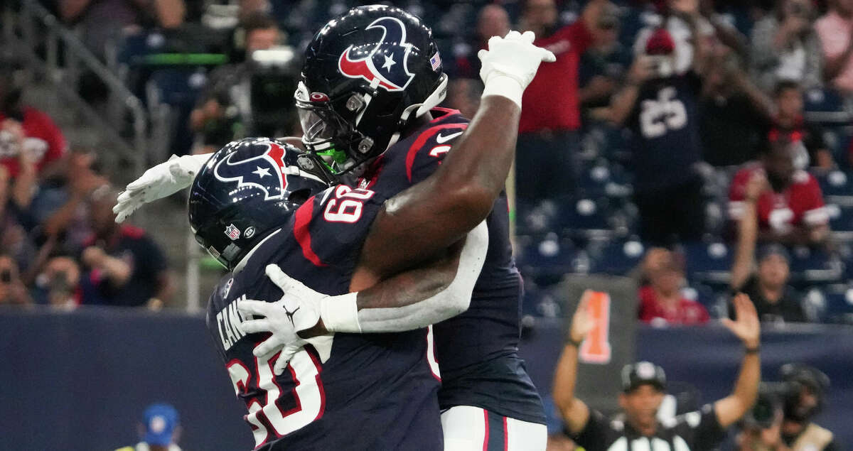 Houston Texans running back Dameon Pierce (31) and guard A.J. Cann (60) celebrate Pierce's 1-yard touchdown run against the San Francisco 49ers during the first half of an NFL football game Thursday, Aug. 25, 2022, in Houston.