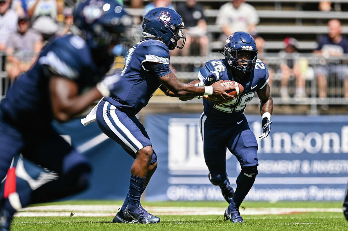 UConn running back Nathan Carter carries the ball against CCSU on Saturday at Rentschler Field.