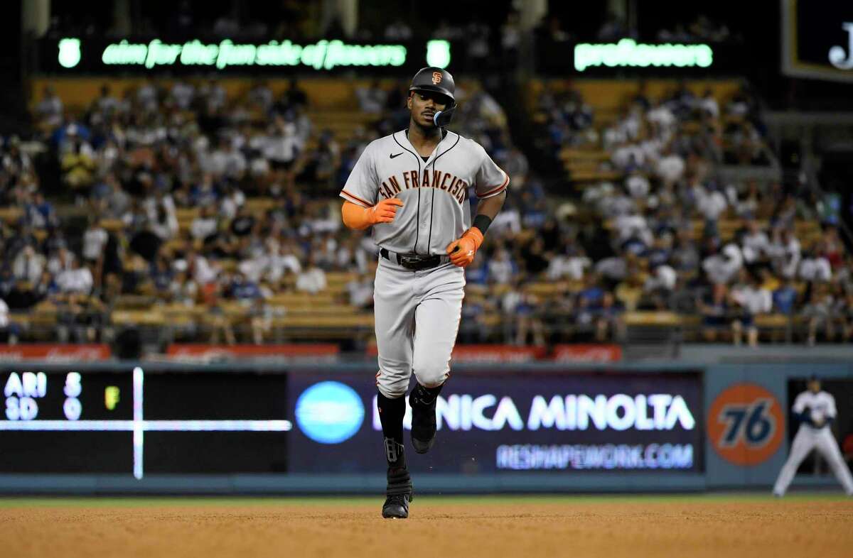 San Francisco Giants' Lewis Brinson, from left, celebrates with