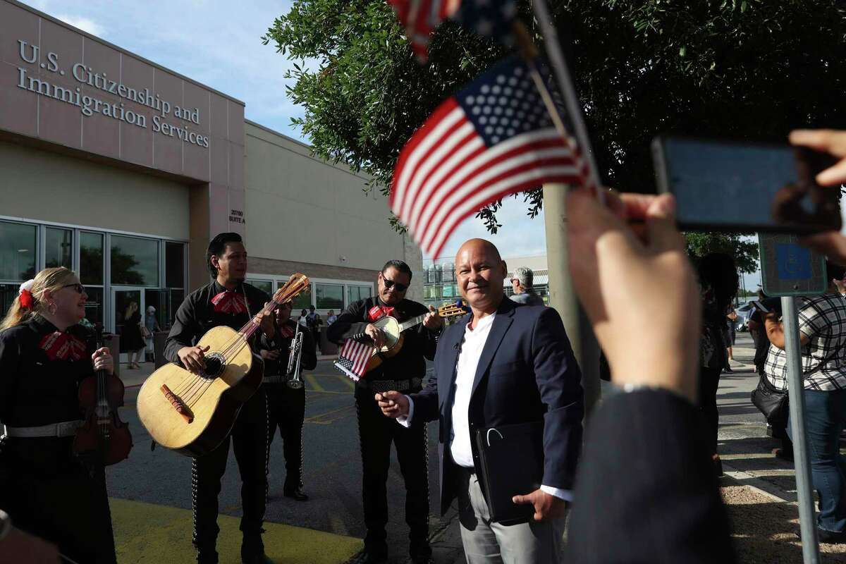 Samuel Monsivais, 53, is serenaded by Mariachi Sol y Luna after his citizenship ceremony at the United States Citizenship and Immigration Service Field Office in San Antonio, Friday, May 13, 2022. Monsivais, who is from Gomez Palacios, Mexico, has held a green card since 2015. According to officials, around 300 were naturalized during ceremonies held throughout the day.