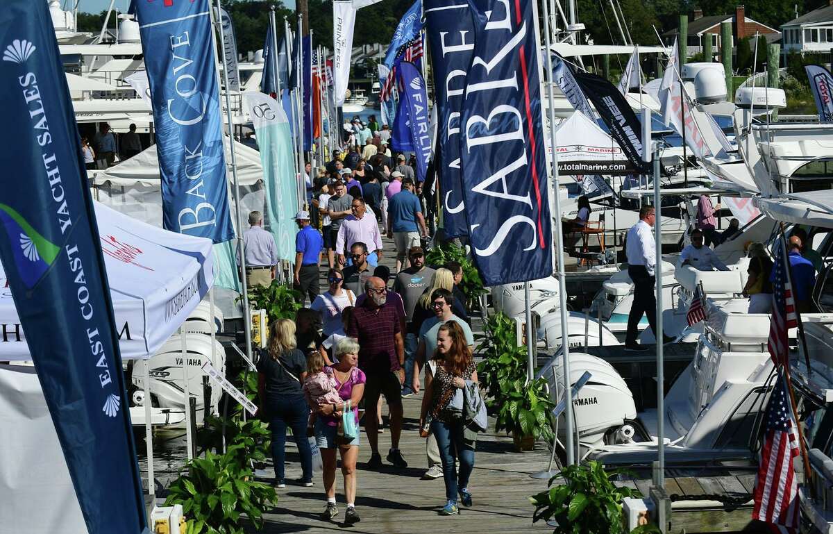 FILE PHOTO: Visitors browse watercraft at The Norwalk Boat Show Saturday, September 25, 2021, at Cove Marina in Norwalk, Conn.