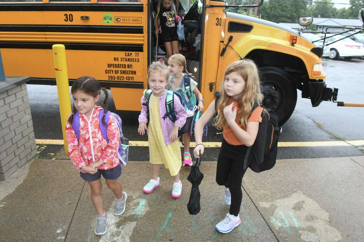 Students arrive for the first day of school at Mohegan Elementary School, in Shelton, Conn. Sept. 6, 2022.