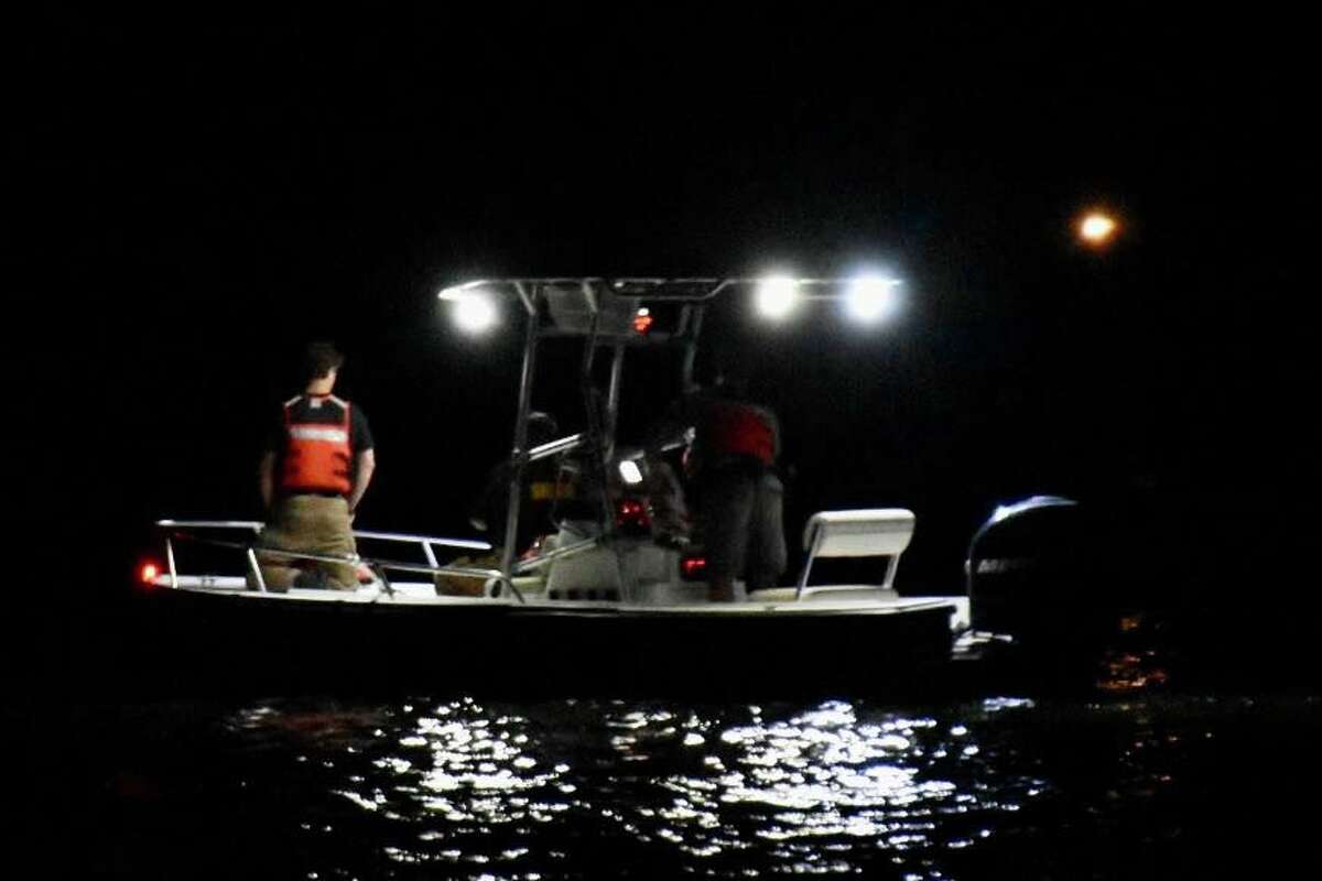 The Benzie County Sheriff's Office maritime unit searches into the night for a drowning victim on Sept. 2. at Upper Herring Lake. 