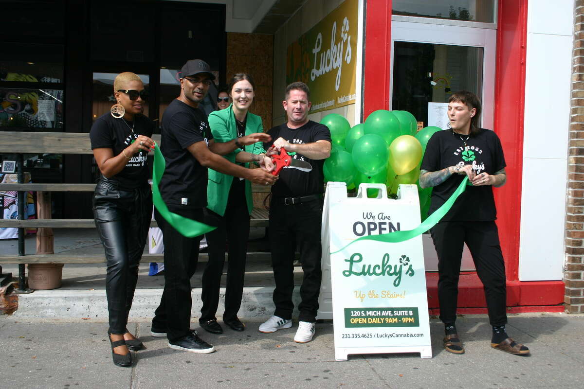 Lucky's Community Cannabis Company hosted it official grand opening this weekend with live music, tarot readings, vendors and special deals in the store. Co-owner Marc Robert (center) cuts the ribbon officially marking the opening of the store.