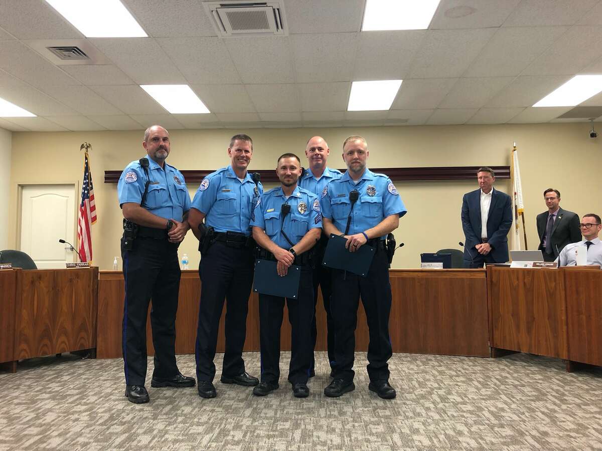 Edwardsville Police Sgt. Jason Penick, center, and Ofc. Tyler Heffington, right, earned the department's Life Saving Award Tuesday at city council for their actions on a call in August. With them are Sgt. Matt Evers, left, Chief Michael Fillback, second from left, and Dep. Chief Michael Lybarger.