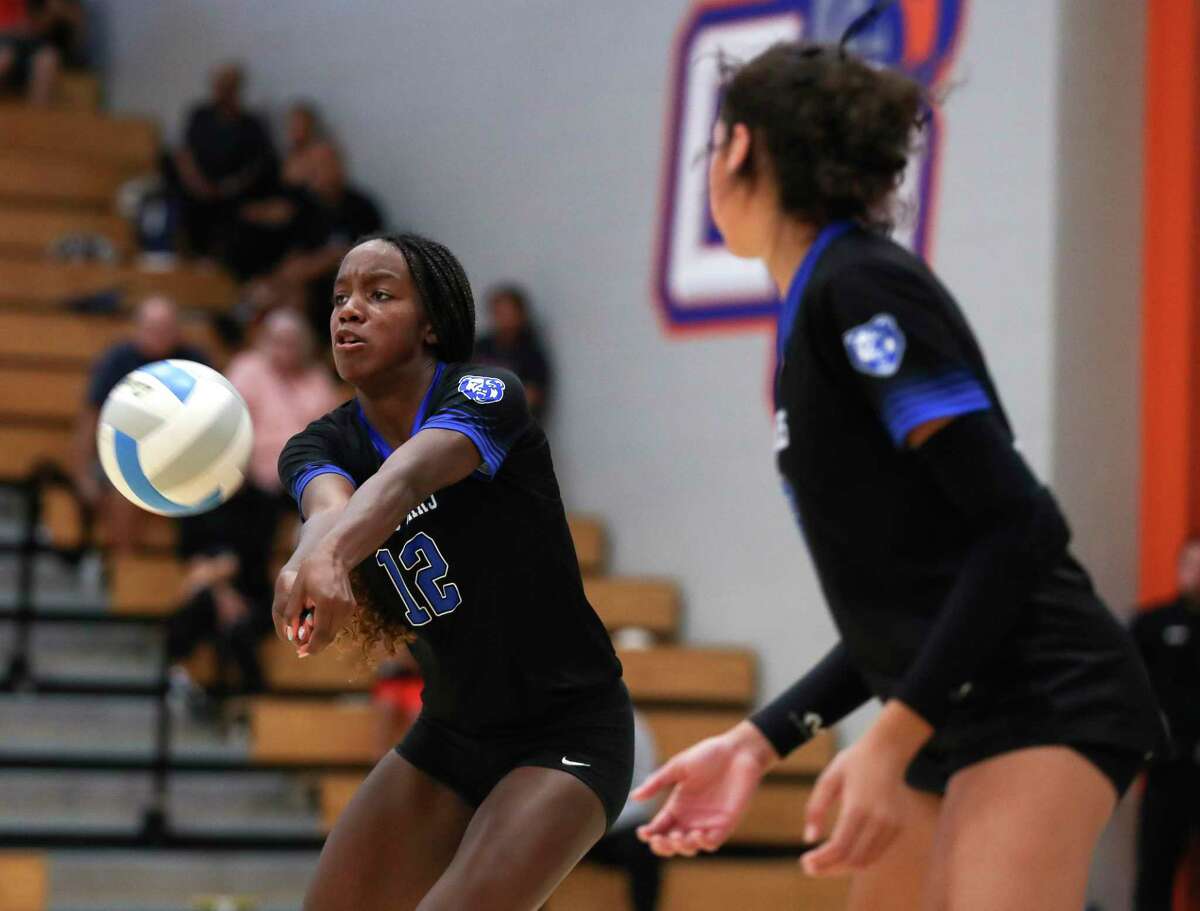 Grand Oaks' Samara Coleman (12), shown here earlier season, helped the Grizzlies to a five-set win Friday night at The Woodlands.