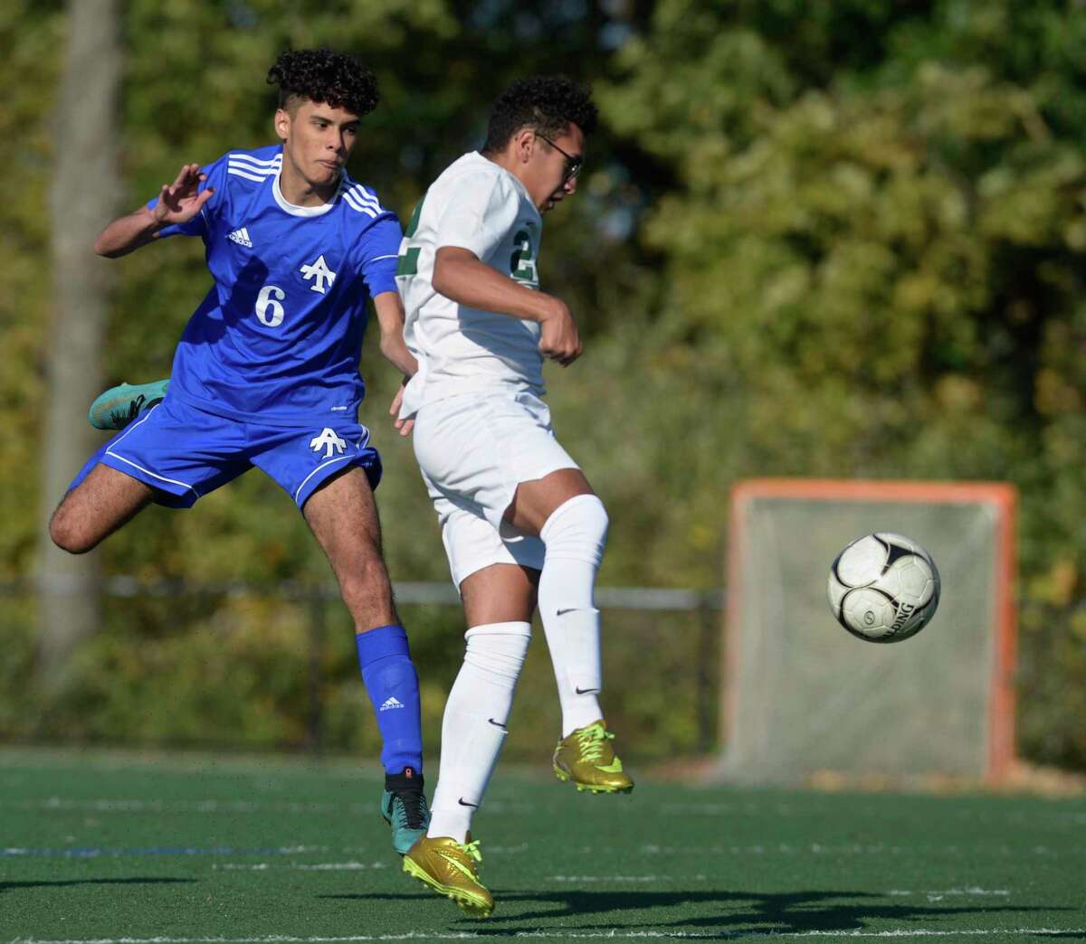Abbott Tech’s Santiago Idrobo (6) and New Milford’s Yousef Eltoukhy (22) fight for the ball.