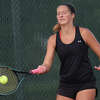 Edwardsville's Zoe Byron hits a shot during Tuesday's match inside the EHS Tennis Center.
