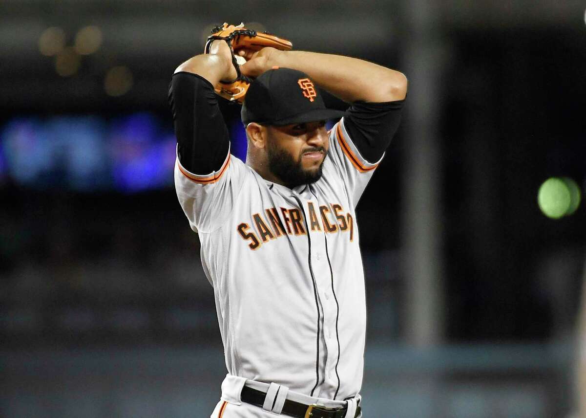 LOS ANGELES, CA - SEPTEMBER 06: Pitcher Jarlin Garcia #66 of the San Francisco Giants reacts after giving up a three-run home run to Joey Gallo of the Los Angeles Dodgers in the second inning at Dodger Stadium on September 6, 2022 in Los Angeles, California. (Photo by Kevork Djansezian/Getty Images)