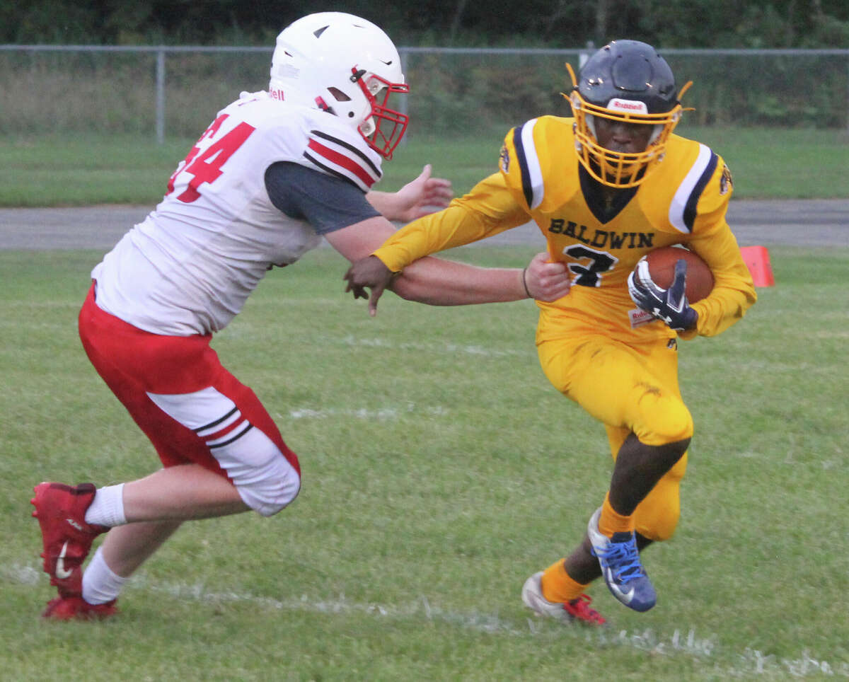 Carmelo Lindsey (right) leads the football attack for Baldwin.