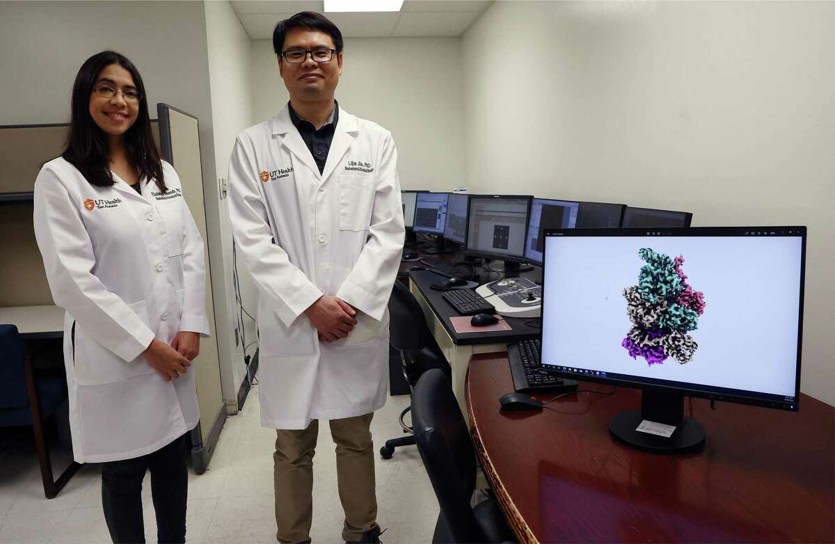 Elizabeth Wasmuth (left), assistant professor of biochemistry and structural biology and Lijia Jia, facility director stand next to the control room of UT Health San Antonio’s new cryo-EM lab. The school is investing $5M over the next three years in the technology called cryo-electron microscopy, which can capture images of elusive proteins which are a thousand times smaller than the width of a human hair.