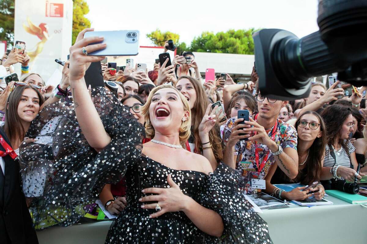 Florence Pugh takes a selfie at the world premiere of the movie 
