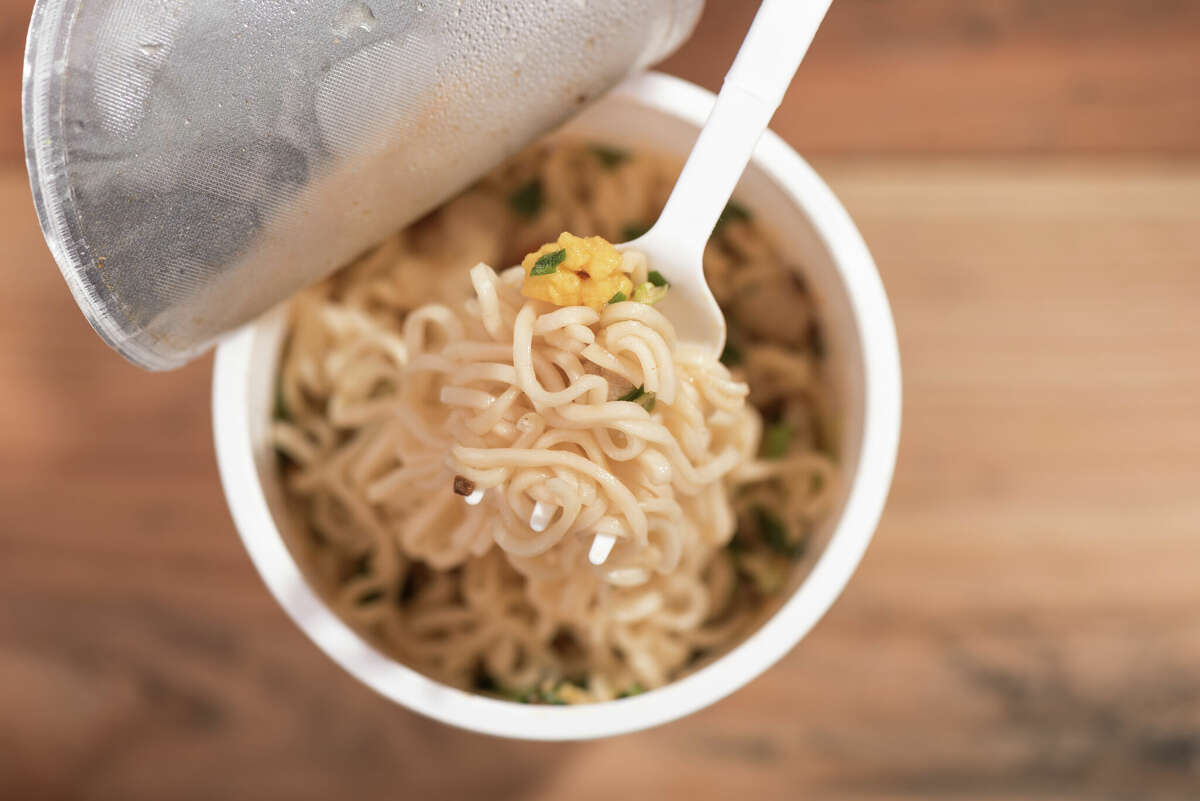 Noodle Cup,noodle soup in a cup,on wooden background