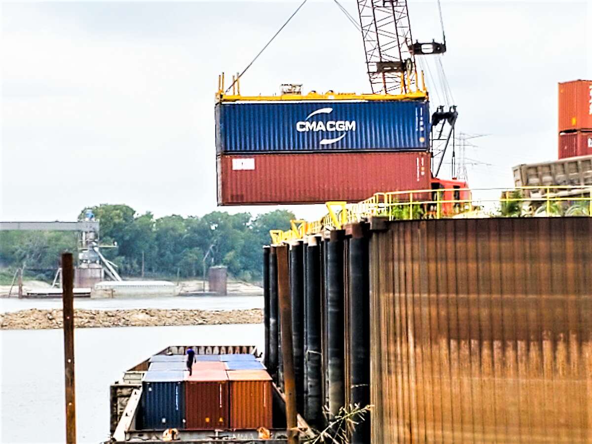 Container cargo is unloaded in a St. Louis area facility. The National Retail Federation is reporting that imports are slowing as the Federal Reserve attempts to slow demand through higher inflation rates.