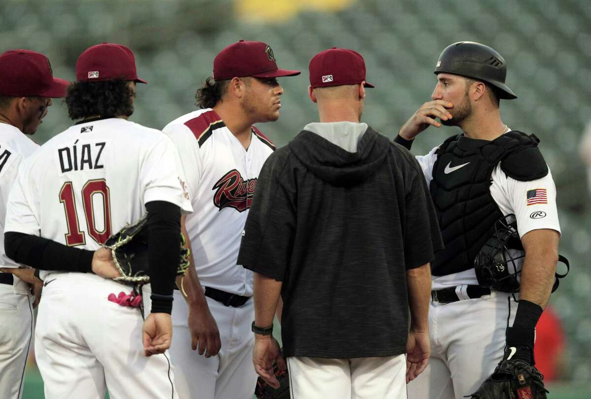 Giants catcher Joey Bart at a meeting on the mound with pitcher Luis Ortiz (28) during a game between the Sacramento River Cats and the El Paso Chihuahuas at Sutter Health Park on June 23.