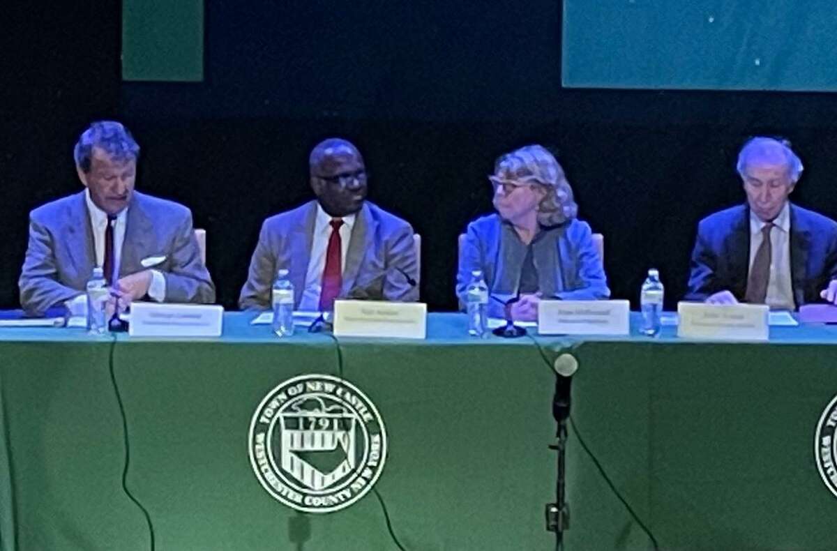 From left, Westchester County Executive George Latimer; Deputy County Executive Kenneth Jenkins; director of operations Joan McDonald; and county attorney John Nonna listen to public comments about the Westchester County Airport at the meeting Tuesday at the Chappaqua Performing Arts Center in New York.
