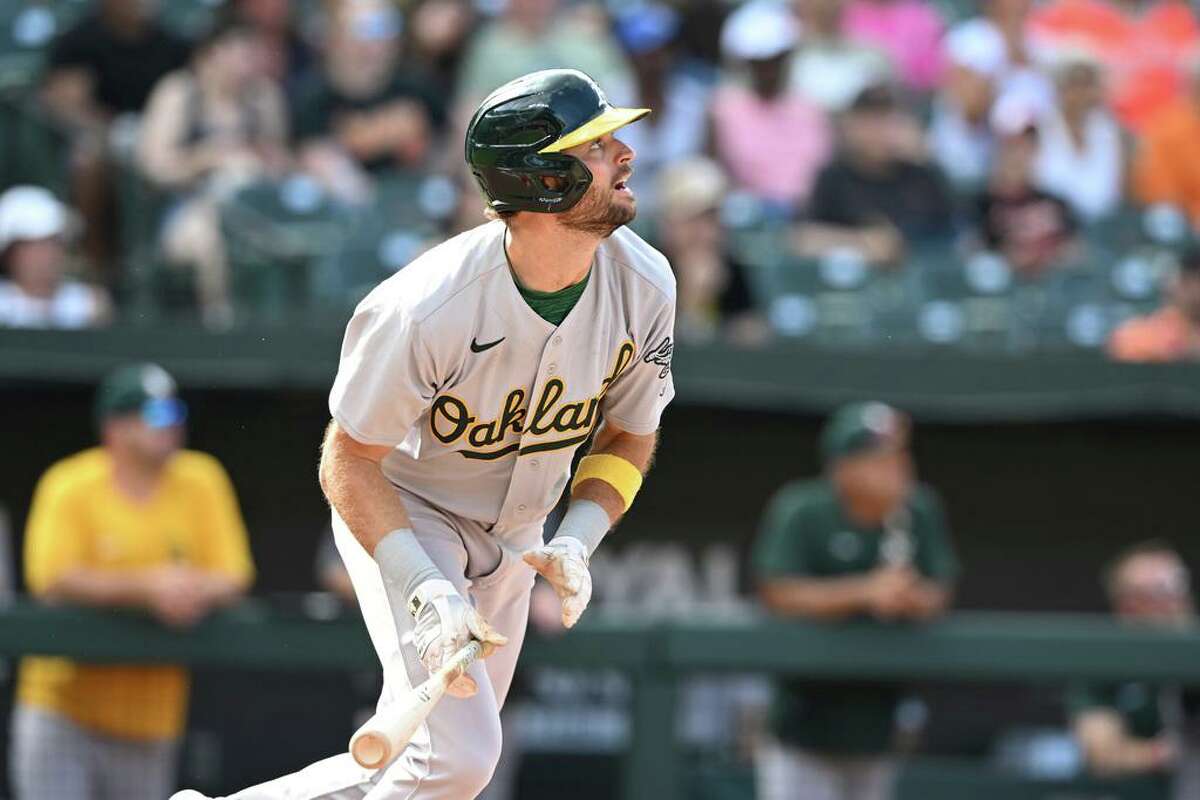 Oakland Athletics' Cody Thomas follows through on a single against the Baltimore Orioles in the eighth inning of a baseball game, Sunday, Sept. 4, 2022, in Baltimore. (AP Photo/Gail Burton)