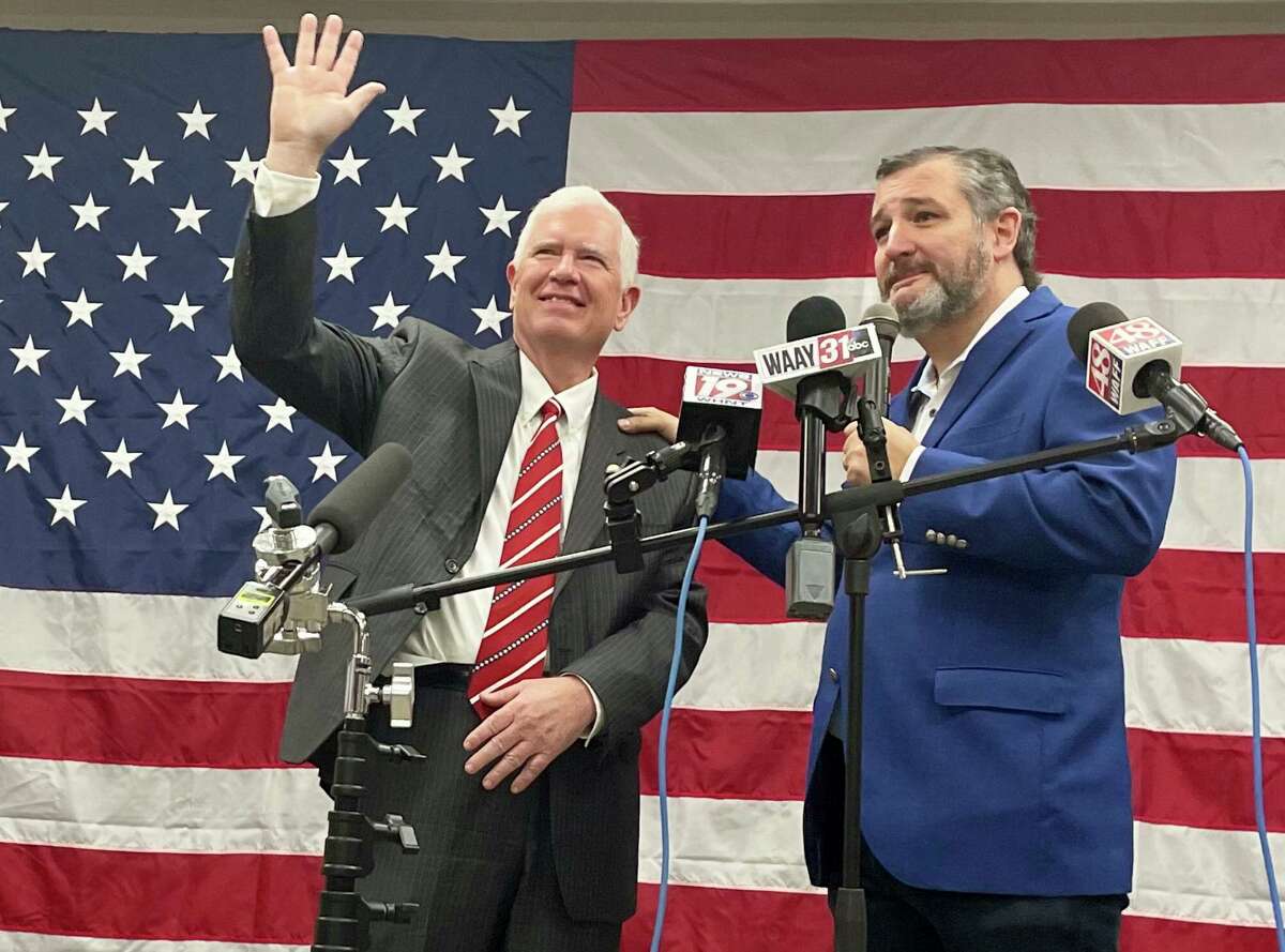 U.S. Rep. Mo Brooks, left, waves during a campaign appearance with Sen. Ted Cruz of Texas in Huntsville, Ala., on Monday, May 23, 2022. Brooks is among the candidates seeking the Republican nomination for the seat held by Alabama Sen. Richard Shelby, who is retiring. (AP Photo/Kim Chandler)