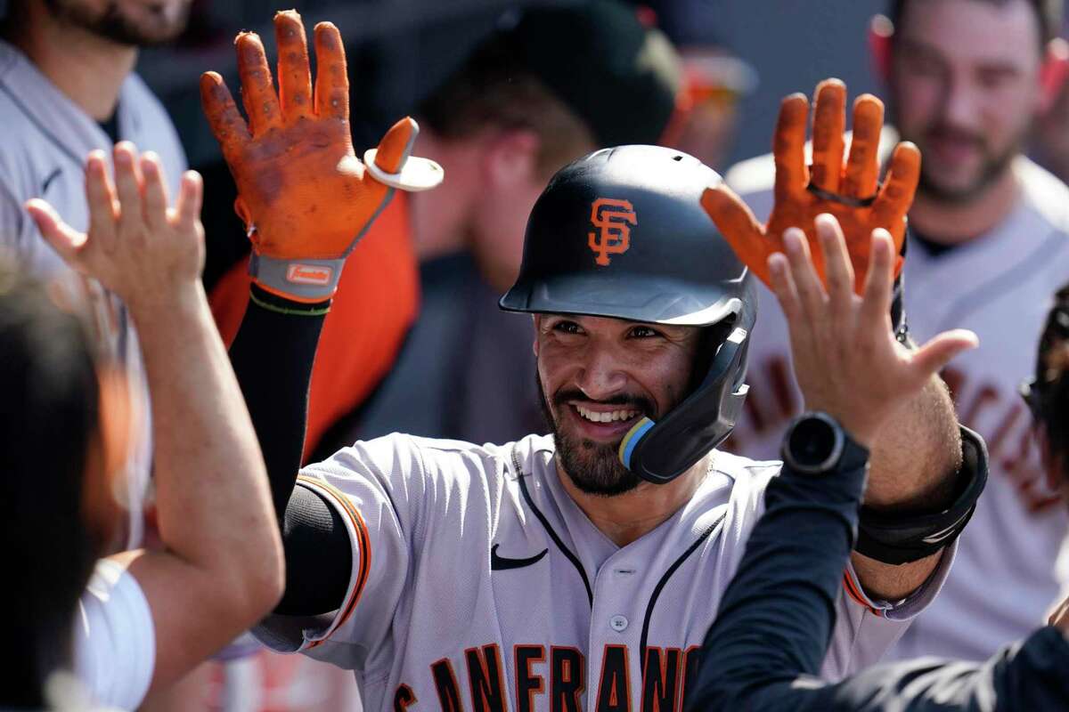 The Giants’ David Villar, who hit a two-run homer in the fifth inning, celebrates his second home run, a solo shot, in the seventh inning with teammates.