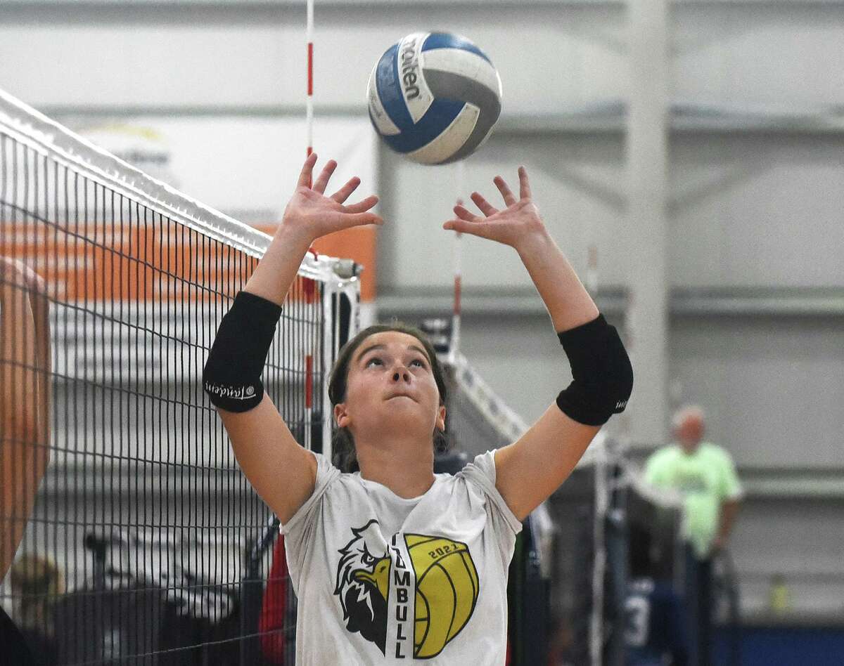 Trumbull’s Maggie Carley sets the ball during the Nectar Volleyball Tournament at the Northeast Athletic Center in Norwalk on Saturday, Sept. 3, 2022.