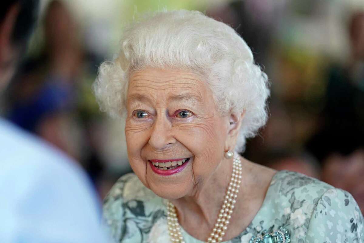 FILE - Britain's Queen Elizabeth II looks on during a visit to officially open the new building at Thames Hospice, Maidenhead, England July 15, 2022. Buckingham Palace says Queen Elizabeth II is under medical supervision as doctors are “concerned for Her Majesty’s health.” The announcement comes a day after the 96-year-old monarch canceled a meeting of her Privy Council and was told to rest. (Kirsty O'Connor/Pool Photo via AP, File)