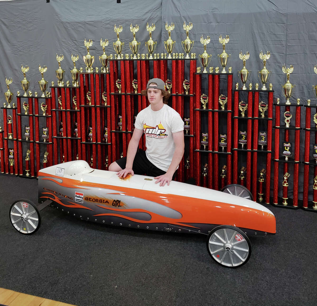 Midland's Jamison Geisler poses with his soap box derby car at the National Derby Rallies in Bowling Green, Ky., recently.