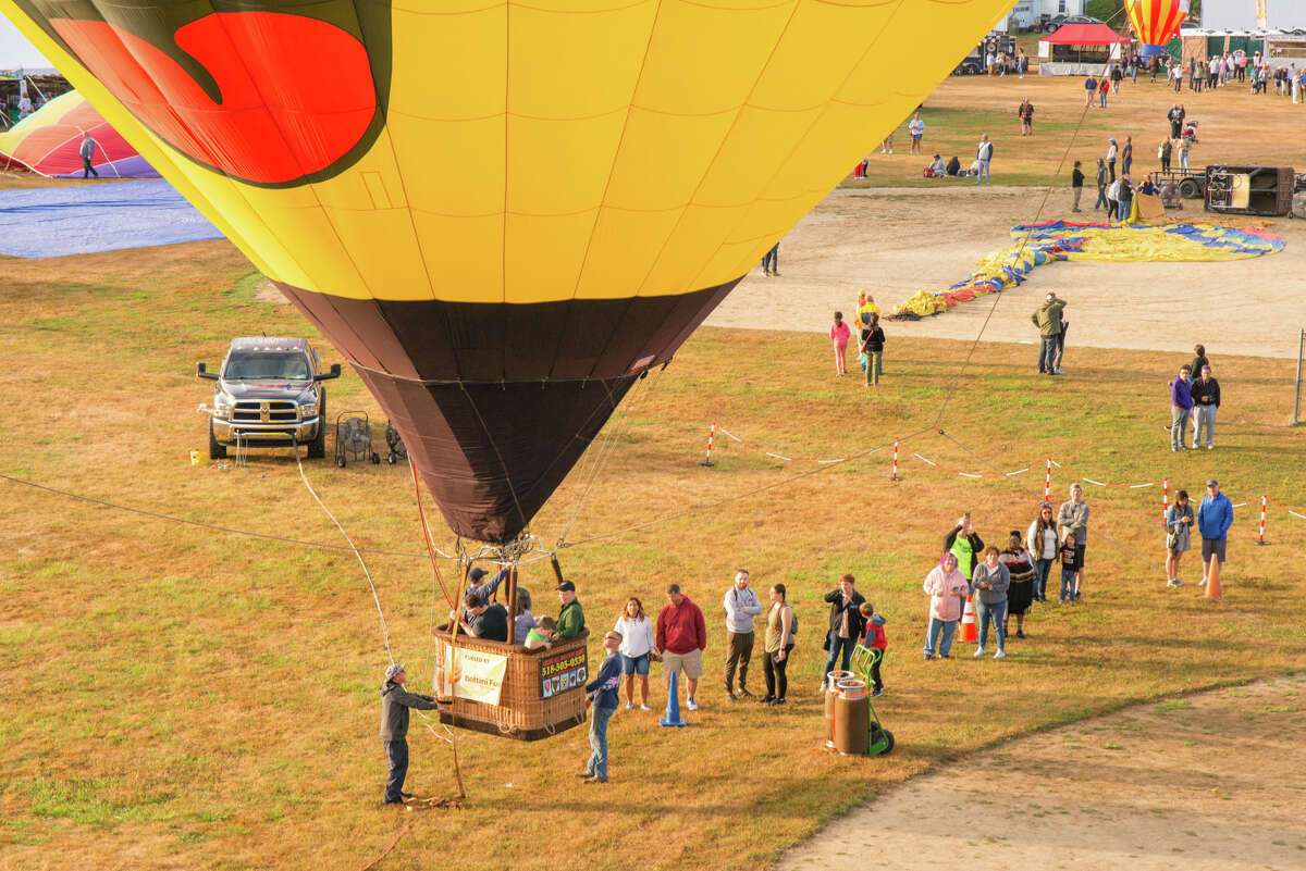 Revelers line up for the tethered balloon at the Hudson Valley Hot Air Balloon Festival on Saturday, September 3, 2022.