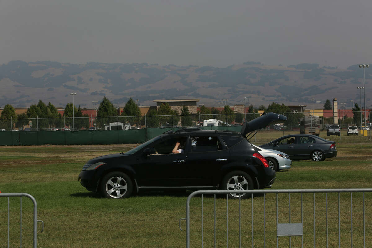 People fleeing wildfires gather at an evacuation center at the Sonoma-Marin Fairgrounds and Event Center in 2020.