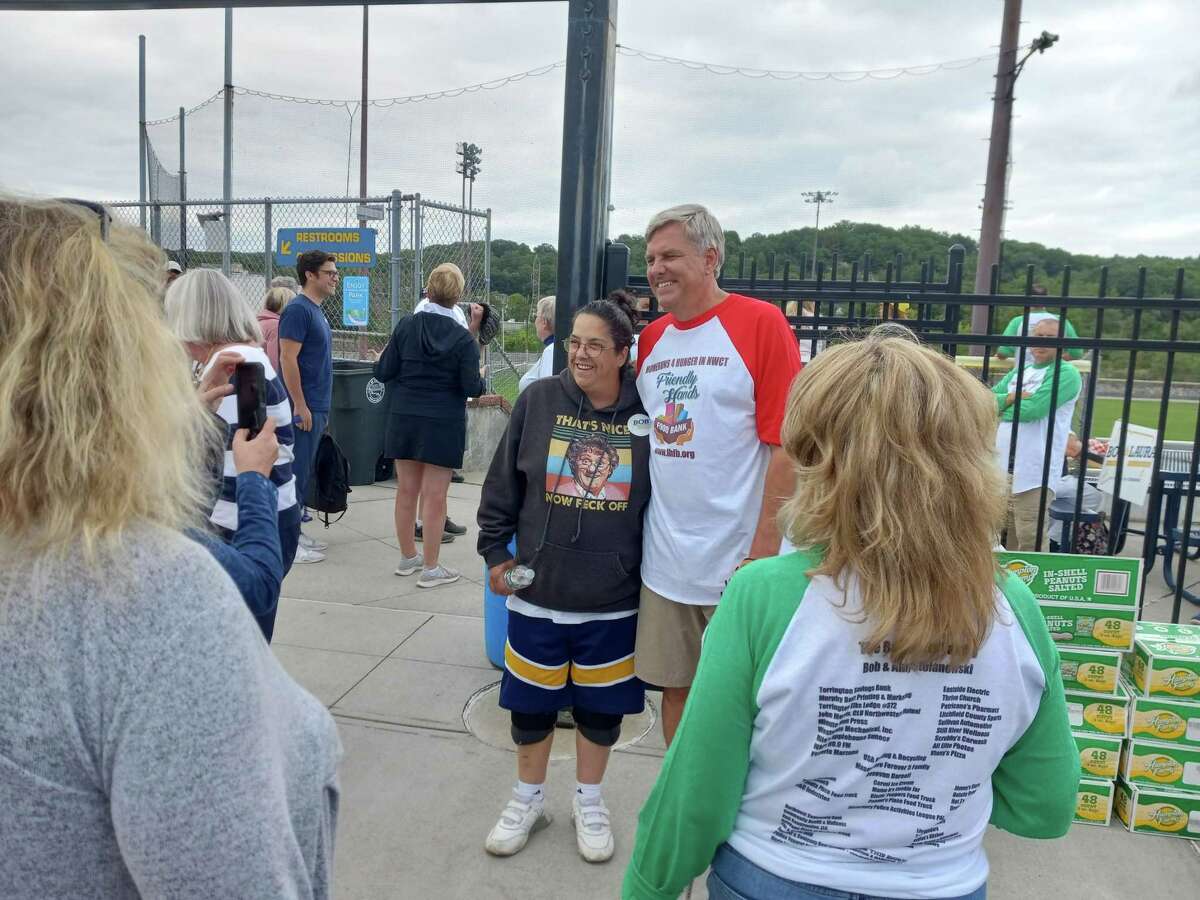 Republican gubernatorial candidate Bob Stefanowski, center right, poses with supporters before a charity softball game Wednesday.