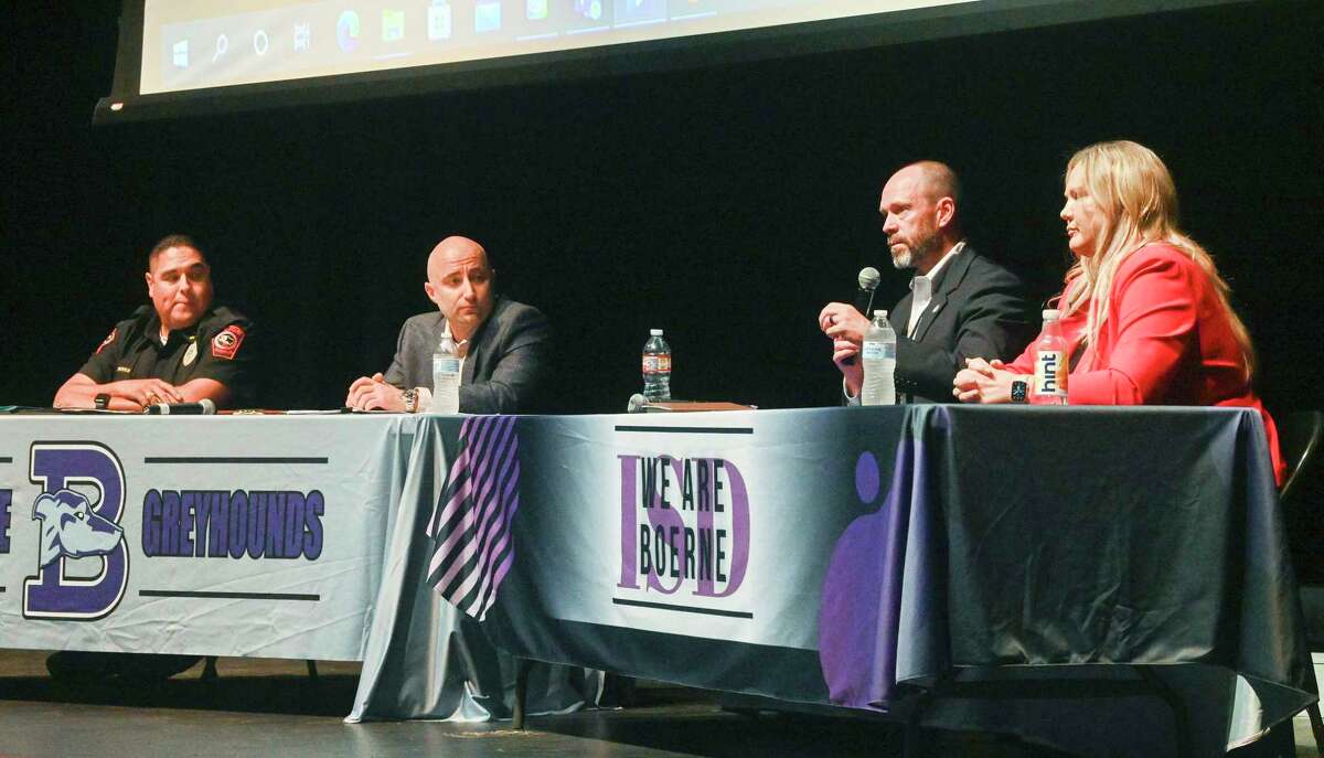 Steve Perez, Boerne police chief, left; Rick Goodrich, Boerne ISD chief of safety and security; Thomas Mangiamele, DEA special supervisory agent; and Nicole Bishop, Kendall County criminal district attorney, speak about the lethality of fentanyl during the “One Pill Can Kill” fentanyl information session at Boerne High School on Wednesday, Sept. 7, 2022. Parents and students attended to learn about the origin, effects and dangers of the illicit drug.
