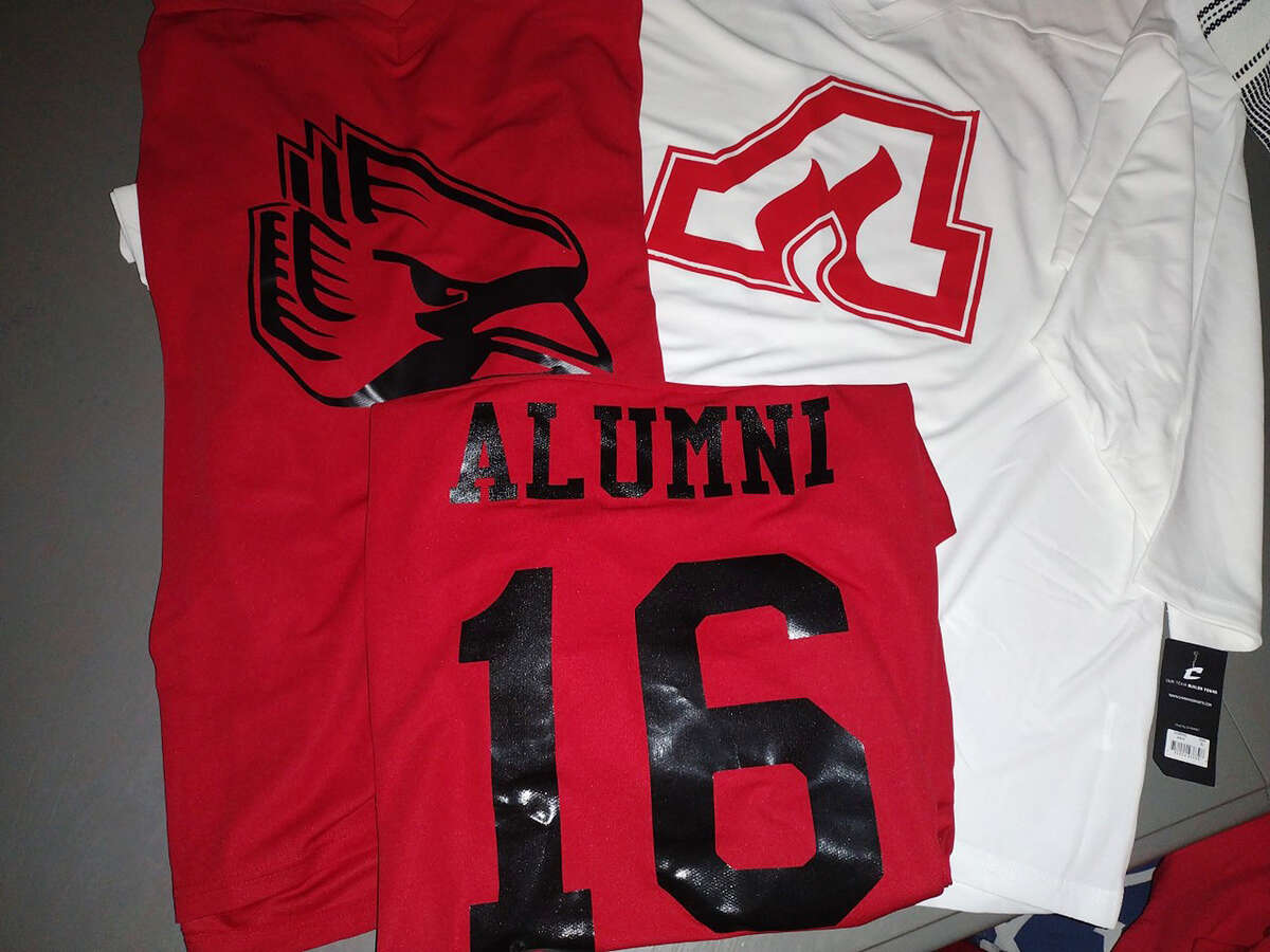 Jerseys for this year's Alton Redbirds Alumni Hockey Game include white jerseys with the former Alton Flames logo and red jerseys with the current Redbirds logo.