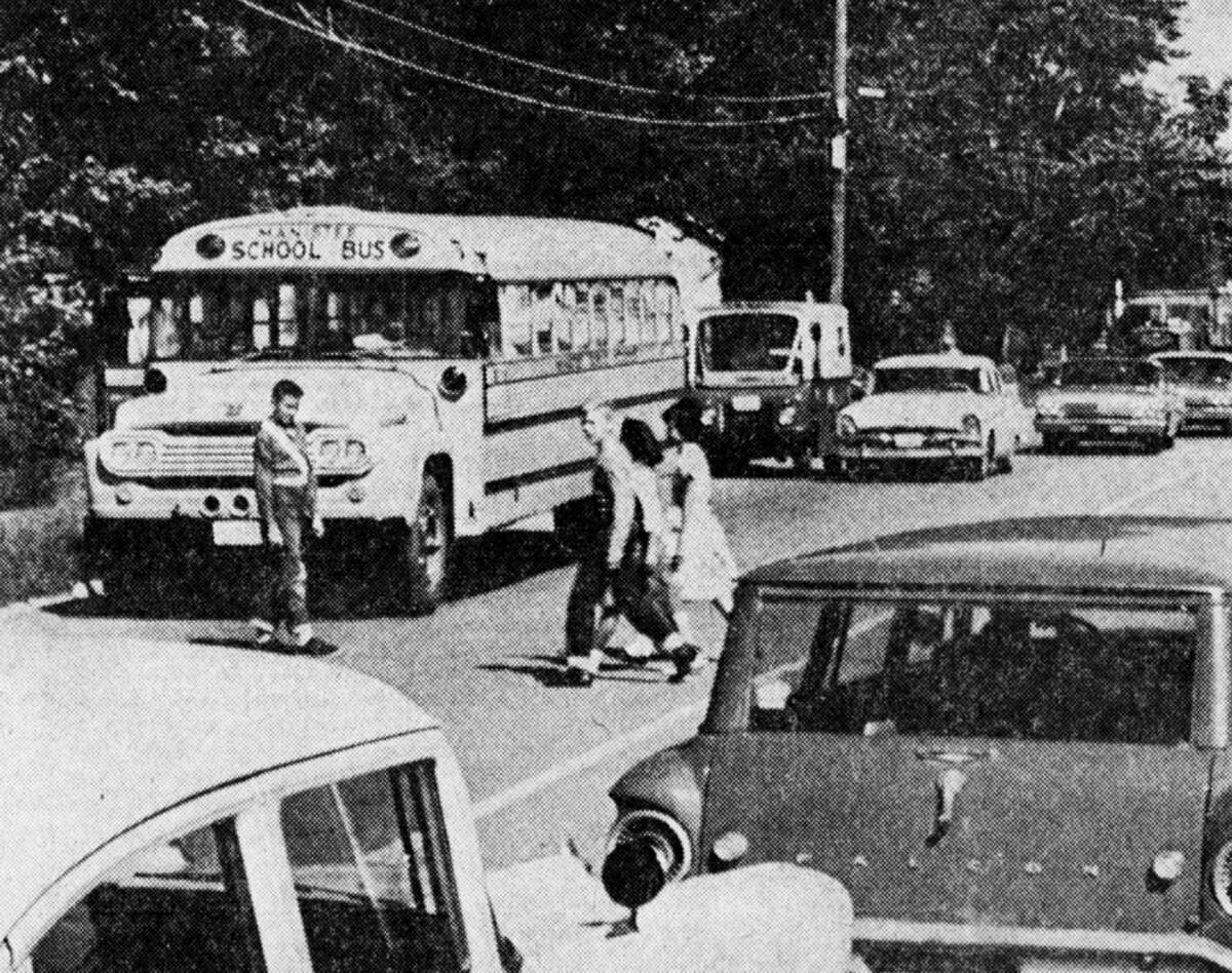 With the new school year now in progress, motorists are again reminded of the Michigan laws regarding school buses. Michigan law requires drivers traveling in either direction to stop when a school bus stops to take on or discharge passengers, except on a divided highway. The photo was published in the News Advocate on Sept. 10, 1962.