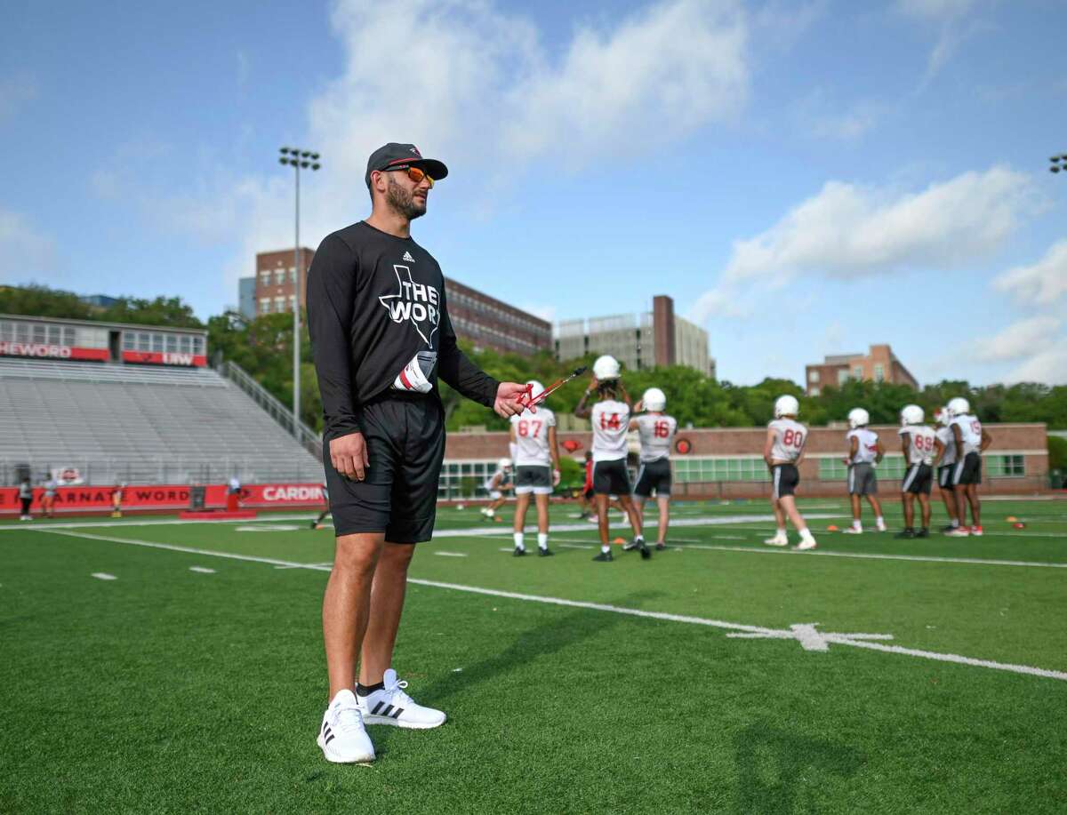 Head coach G.J. Kinne watches his team during University of the Incarnate Word football practice on Thursday, Aug. 4, 2022.