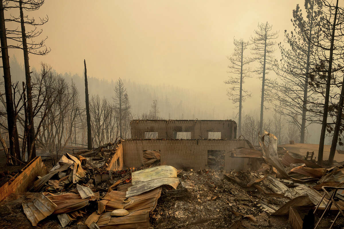 A destroyed structure rests in a clearing as the Mosquito Fire burns along Michigan Bluff Rd. in unincorporated Placer County, Calif., on Wednesday, Sept. 7, 2022.