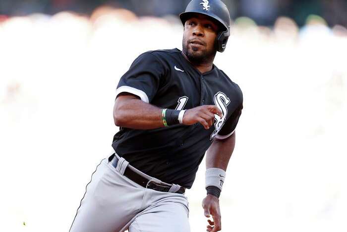 Oakland Athletics Rickey Henderson (24) reacts on a pickoff try by