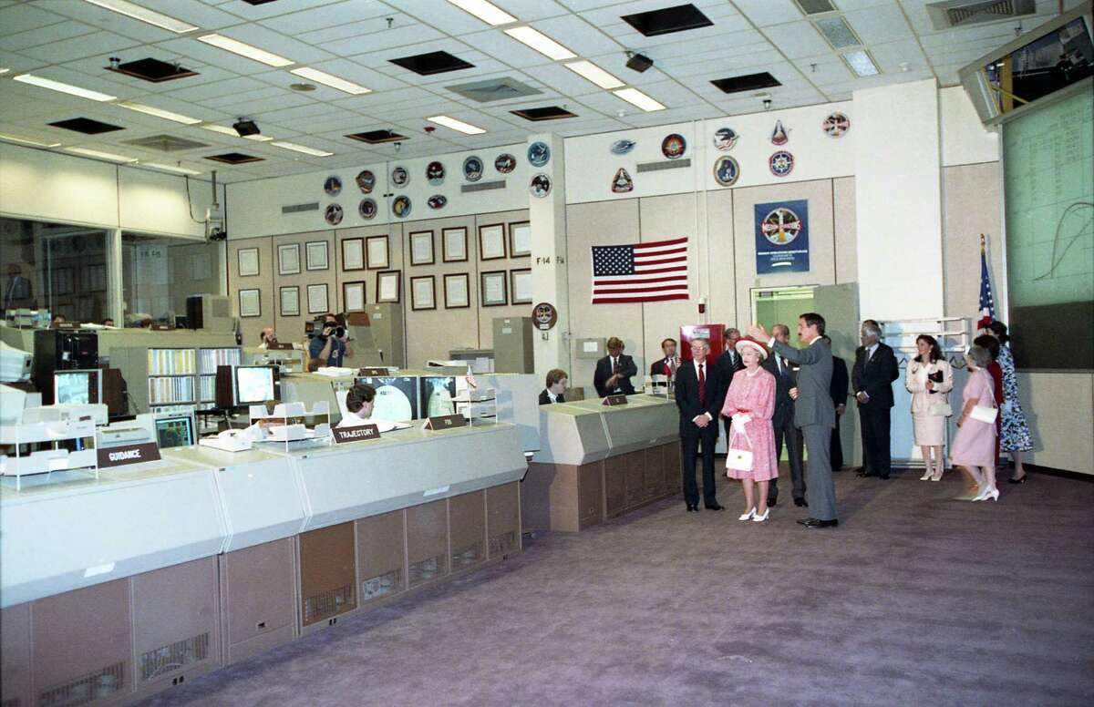 At NASA's Johnson Space Center, astronaut Jeff Hoffman gives Queen Elizabeth II and Prince Philip a tour of the Mission Control Center, May 22, 1991.